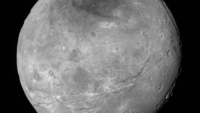 Charon, which is 750 miles (1,200 kilometers) in diameter, displays a surprisingly complex geological history, including tectonic fracturing; relatively smooth, fractured plains in the lower right; several enigmatic mountains surrounded by sunken terrain features on the right side; and heavily cratered regions in the center and upper left portion of the disk. There are also complex reflectivity patterns on Charon’s surface, including bright and dark crater rays, and the conspicuous dark north polar region at the top of the image. The smallest visible features are 2.9 miles 4.6 kilometers) in size.