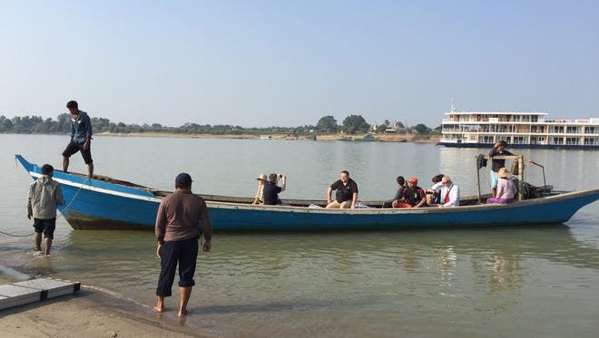 Depending on the landing spot, Avalon Myanmar passengers sometimes are shuttled to shore via local wooden boats.