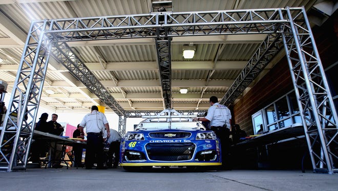 Jimmie Johnson passed prerace inspection, above, but his No. 48 Hendrick Motorsports Chevrolet failed the laser inspection platform following Sunday's race at Chicagoland Speeddway.