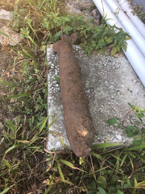 This potential WWII era bomb was found entangled in roots of tree in College Town near Gay St./ Madison St intersection, says property developer.