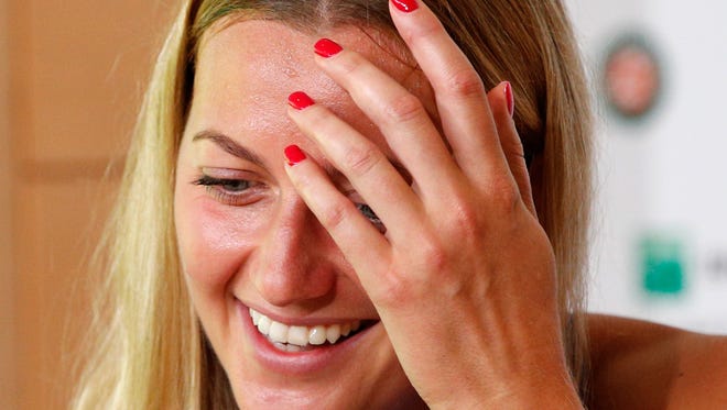 Petra Kvitova of the Czech Republic smiles during a press conference at the Roland Garros stadium May 26 in Paris. Kvitova has confirmed she is making her comeback at the French Open.