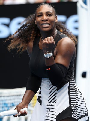 Serena Williams celebrates winning her first-round match against Belinda Bencic of Switzerland at the Australian Open.