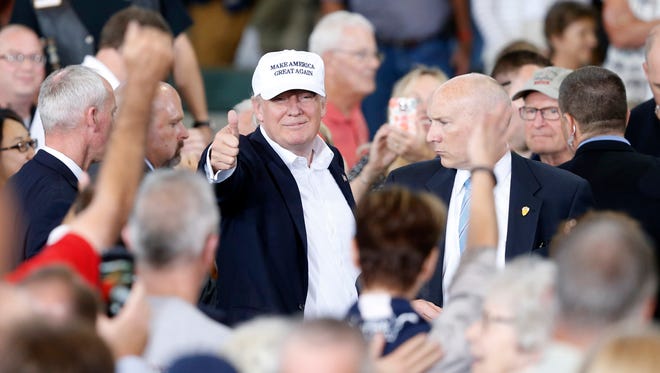 Republican presidential candidate Donald Trump gives a thumbs up to the crowd Saturday, Aug. 27, 2016, after speaking at the second annual Roast and Ride at the Iowa State Fairgrounds in Des Moines.