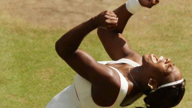 Defending champion Serena Williams reacts as she defeats Vera Zonareva to win the 2010 Wimbledon women's singles final.