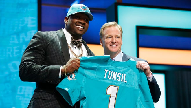 Laremy Tunsil (Ole Miss) with NFL commissioner Roger Goodell after being selected by the Miami Dolphins as the 13th overall pick in the first round of the 2016 NFL Draft at Auditorium Theatre.
