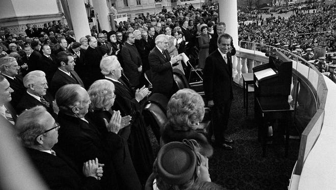 Nixon acknowledges the applause after delivering his second inaugural address on Jan. 20, 1973.