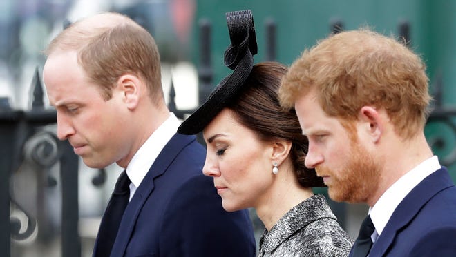 From left, Britain's Prince William, Kate the Duchess of Cambridge and Prince Harry stand together after William laid a wreath after arriving for a "Service of Hope" at Westminster Abbey, two weeks after the March 22 London terror attack, in London, Wednesday, April 5, 2017.