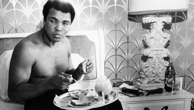 Ali eats breakfast while watching "Mohammad Messenger of God" in his hotel room before his fight against Larry Holmes in 1980.