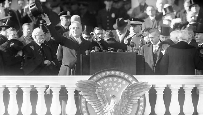 Roosevelt waves from the inaugural stand on Capitol Hill on Jan. 20, 1941, the start of his third term.