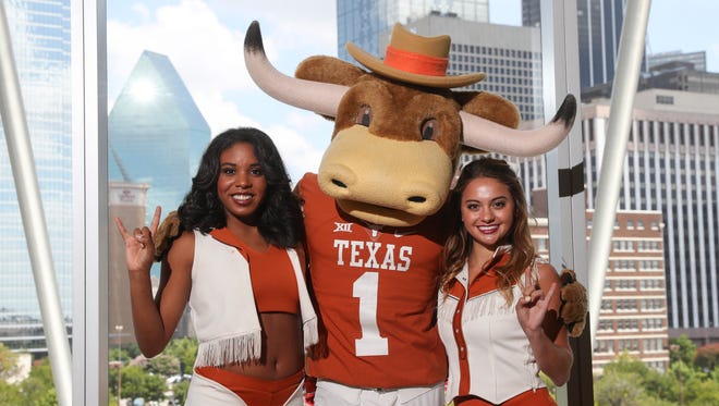 Texas Longhorns cheerleaders and mascot pose for a photo during the Big 12 Media Days at Omni Dallas Hotel.