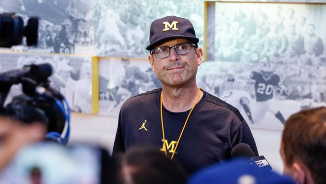 Michigan Wolverines coach Jim Harbaugh speaks with media at the Towsley Museum in Schembechler Hall in Ann Arbor, Aug. 11, 2017.