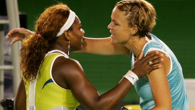 Serena Williams, left, and  compatriot Lindsay Davenport, top seed, hug each other after their  women's singles final match at the 2005 Australian Open. Williams won the match, 2-6, 6-3, 6-0.