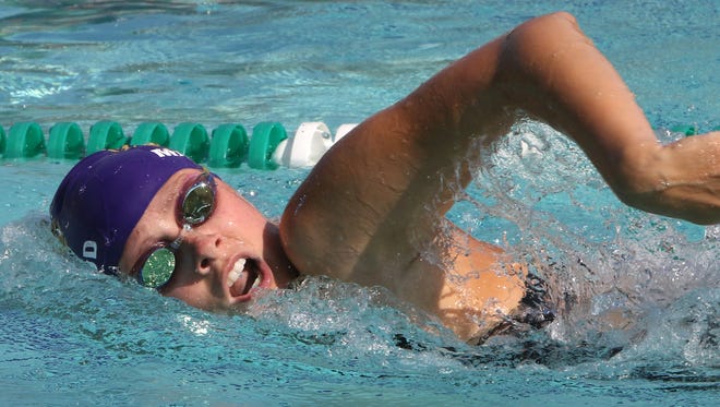 New Berlin Eisenhower's Maddie Mainwood swims a leg of the 200-meter freestyle relay during the Whitnall Falcon FunFest Invitational on Aug. 19 at the Village Club in Greendale, the season's only outdoor swim meet.
