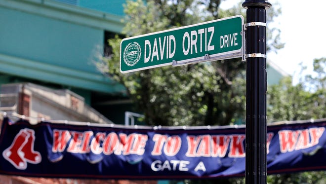 A new "David Ortiz Drive" street sign is posted outside Fenway Park.