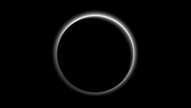 Pluto sends a breathtaking farewell to New Horizons. Backlit by the sun, Pluto’s atmosphere rings its silhouette like a luminous halo in this image taken by NASA’s New Horizons spacecraft around midnight EDT on July 15. This global portrait of the atmosphere was captured when the spacecraft was about 1.25 million miles (2 million kilometers) from Pluto and shows structures as small as 12 miles across. The image, delivered to Earth on July 23, is displayed with north at the top of the frame.