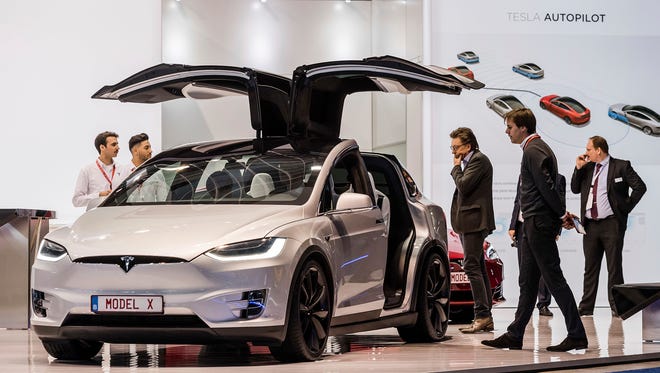 A Tesla Model X reportedly operating on autopilot hit a Phoenix police motorcycle March 21, 2017. The officer wasn't on the motorcycle at the time and no damage was reported to either vehicle. The Tesla Model X on display during the media day of the 95th European Motor Show in Brussels on Jan. 13, 2017.