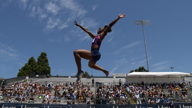 Tianna Bartoletta soars to the long jump title with a leap of 23-1 3/4.