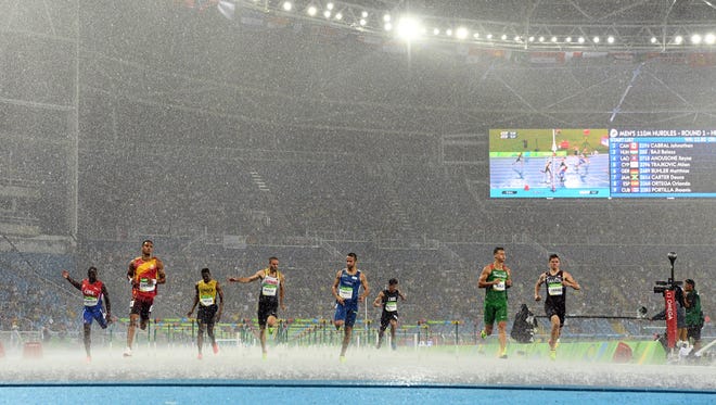 A general view during the men's 110-meter hurdles Round 1 heat in the rain.