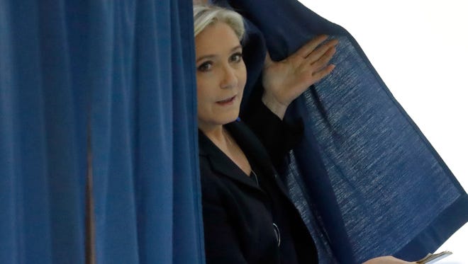 Far-right leader and candidate for the 2017 French presidential election Marine Le Pen exits a polling booth before voting for the first-round of the presidential election in Henin-Beaumont, France, on April 23, 2017.