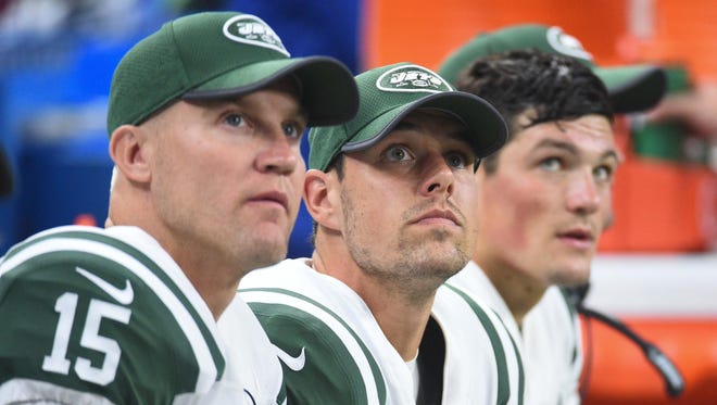 New York Jets quarterback Josh McCown (15) , Bryce Petty (9) and Christian Hackenberg (5) during the second quarter against the Detroit Lions at Ford Field.
