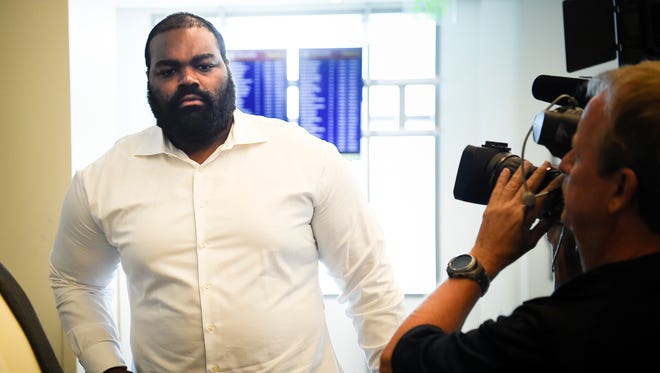 Former Titan Michael Oher (center) leaves the Justice A.A. Birch Building after his preliminary hearing for assaulting an Uber driver was continued to a later date in Judge Melissa Blackburn's courtroom Friday, July 21, 2017, in Nashville, Tenn.