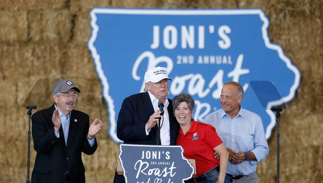 Gov. Terry Branstad joins Republican presidential candidate Donald Trump on stage along side Sen. Joni Ernst and Rep. Steve King during the second annual Roast and Ride at the Iowa State Fairgrounds in 2016.