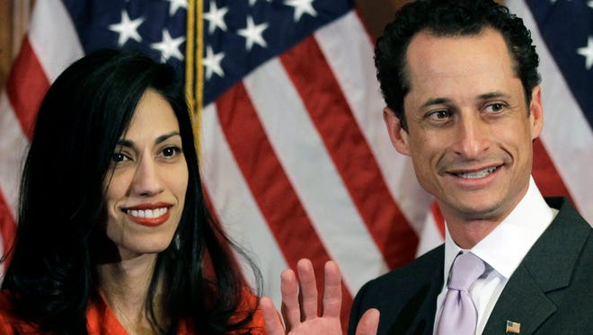 Weiner and Abedin pose for photographs after the ceremonial swearing-in of the 112th Congress on Capitol Hill on Jan. 5, 2011.