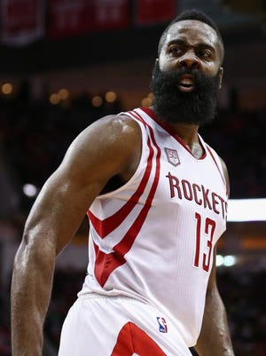 James Harden (13) reacts after a play during the third quarter against the Phoenix Suns at Toyota Center.