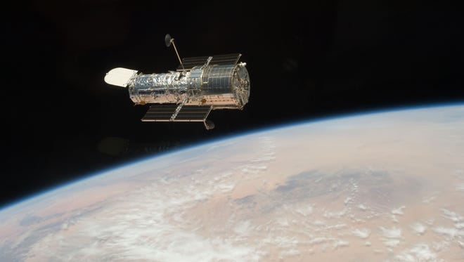 The Hubble Space Telescope is seen from the Space Shuttle Atlantis on May 19, 2009 as the two spacecraft continue their relative separation, after having been linked together for the better part of a week.