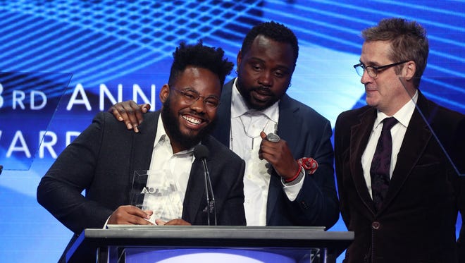Writer Stephen Glover, left, actor Brian Tyree Henry and executive producer Paul Simms accept the award for 'Outstanding Achievement in Comedy' for FX's 'Atlanta' at the 33rd Annual Television Critics Association Awards.