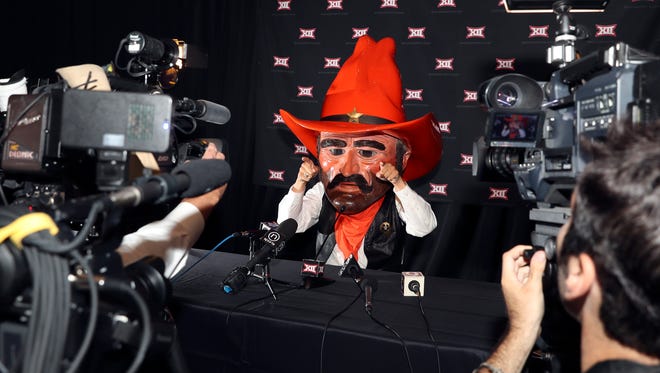 Oklahoma State Cowboys mascot speaks to the media during the Big 12 Media Days at Omni Dallas Hotel.