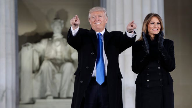 President-elect Donald Trump and his wife Melania Trump arrive at a pre-Inaugural 'Make America Great Again! Welcome Celebration' at the Lincoln Memorial in Washington, Jan. 19, 2017.