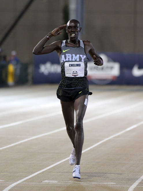 Paul Chelimo celebrates after winning the 5,000 in a meet record 13:08.62.