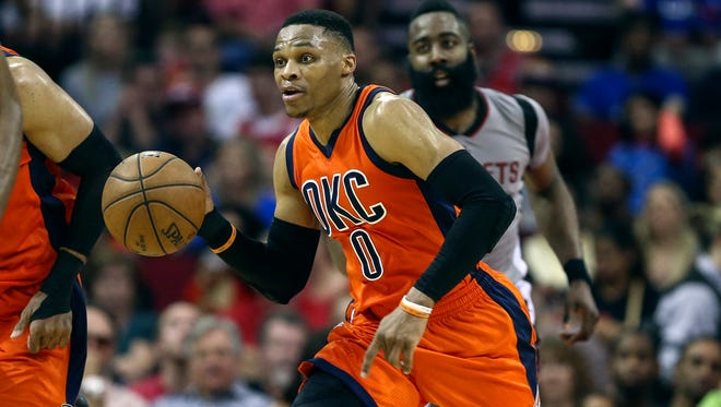 Oklahoma City Thunder guard Russell Westbrook (0) dribbles the ball during the third quarter against the Houston Rockets at Toyota Center.