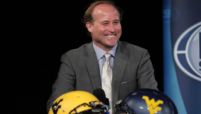 West Virginia Mountaineers head coach Dana Holgorsen speaks to the media during the Big 12 Media Days at Omni Dallas Hotel.