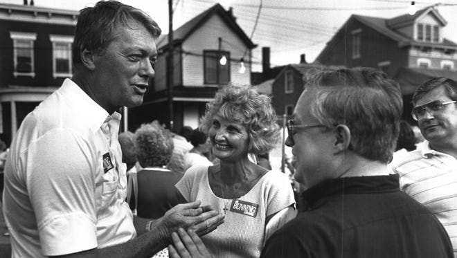 JULY 1986: Former baseball great Jim Bunning and his wife Mary, center, greet people at a church picnic in Bellevue, Ky.