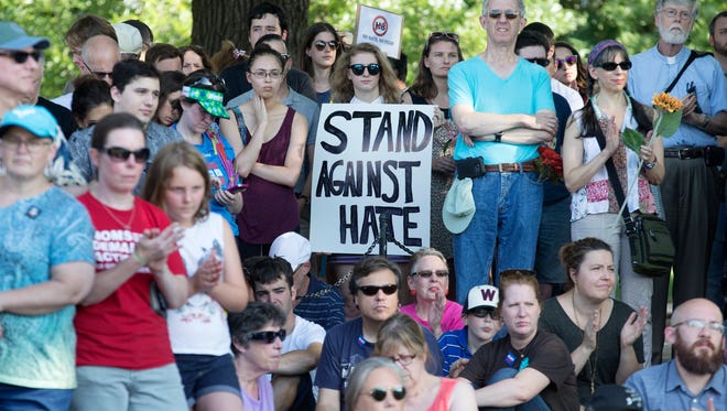 Participants attend a rally to show solidarity against the violence that took place this weekend in Charlottesville, Va.  beside the Lincoln Memorial Reflecting Pool in Washington on Aug. 13, 2017.
