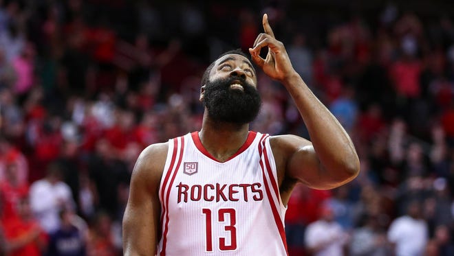 Houston Rockets guard James Harden (13) points up after the Rockets defeated the Washington Wizards at Toyota Center.