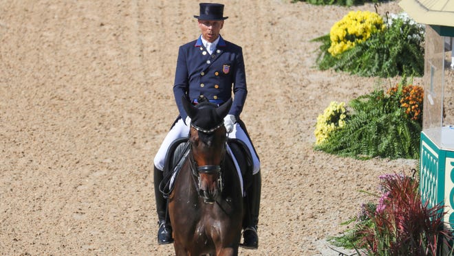 Steffen Peters of the United States rides Legolas 92 during dressage individual grand prix freestyle competition in the Rio 2016 Summer Olympic Games at Olympic Equestrian Centre.