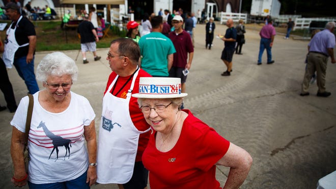 Reta Robey, 70 of Des Monies, center, wears a Reagan-Bush hat from 1984 during Sen. Joni Ernst's Roast and Ride at the Iowa State Fairgrounds on Saturday, August 27, 2016 in Des Moines.