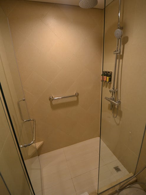 Cabin bathrooms on the Avalon Myanmar have large walk-in showers with Kohler fixtures.