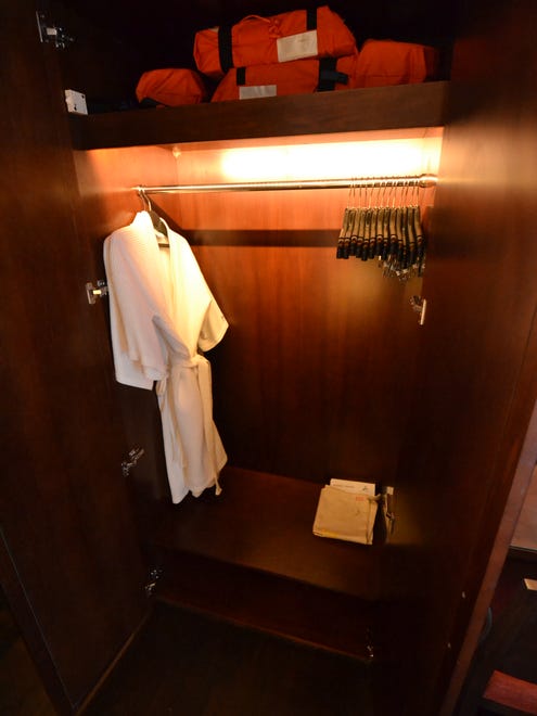 One side of the closets in cabins have room for hanging clothes, shelves for shoes and plush robes for use during the voyage.