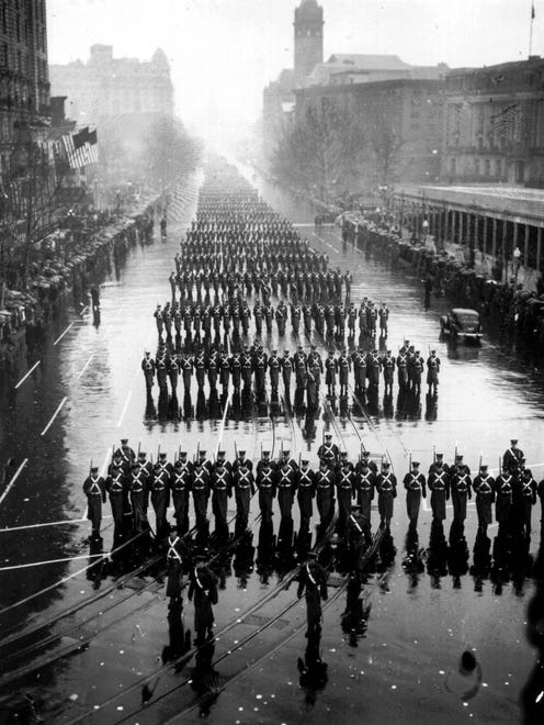 Military units splash along in the pouring rain during Roosevelt's inaugural parade on Jan. 20, 1937.