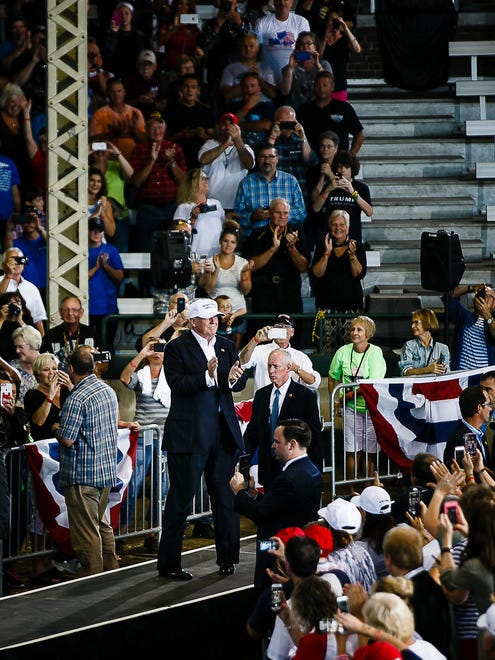 Republican Presidential candidate Donald Trump walks to the podium during Sen. Joni Ernst's Roast and Ride at the Iowa State Fairgrounds on Saturday, August 27, 2016 in Des Moines.
