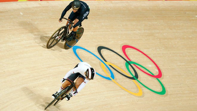 Kristina Vogel of Germany leads and Natasha Hansen of New Zealand compete during the women's sprint 1/8 finals in the Rio 2016 Summer Olympic Games at Rio Olympic Velodrome.
