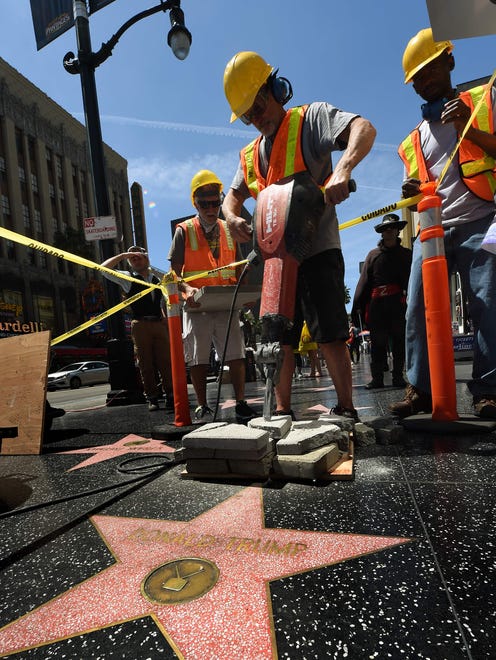 Crew members from the Jimmy Kimmel Show prank passersby by pretending to dig up and remove the Donald Trump star on the Hollywood Walk of Fame on April 20, 2016.