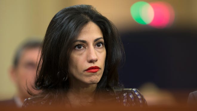 Abedin watches as Clinton testifies on Capitol Hill on Oct. 22, 2015, before the House Benghazi Committee.