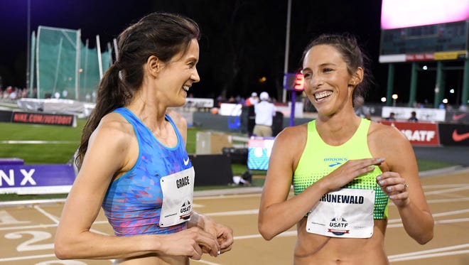 Jun 22, 2017, Sacramento, CA, USA; Gabe Grunewald, (right), who is undergoing chemotherapy for metastatic cancer, talks with Kate Grace after running in Round 1 of the 1,500. Grace advanced to the final.