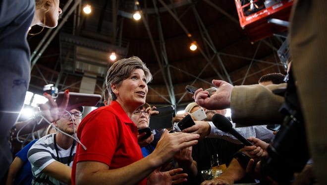 Sen. Joni Ernst arrives and talks to the press at her Roast and Ride at the Iowa State Fairgrounds on Saturday, August 27, 2016 in Des Moines.