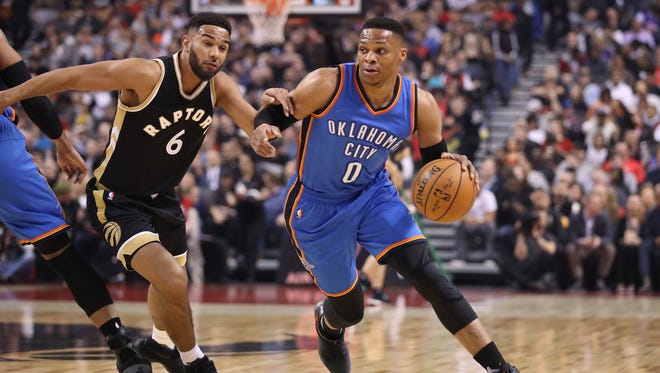 Oklahoma City Thunder point guard Russell Westbrook (0) goes to the basket past Toronto Raptors point guard Cory Joseph (6) at Air Canada Centre.